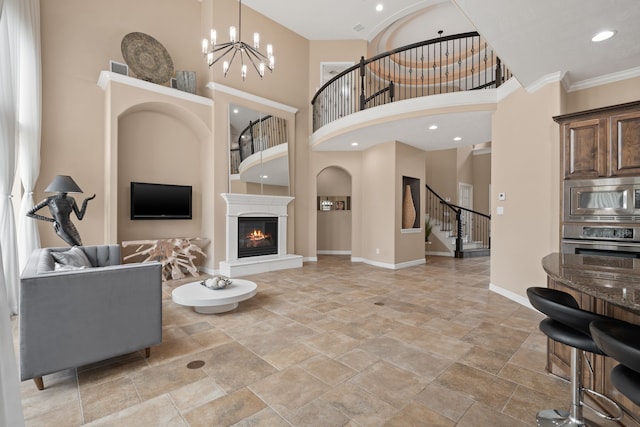 12011 Charlottes Bequest Cir, Cypress, TX 77433 - living room with a towering ceiling, stairway, baseboards, light stone finish floors, and a glass covered fireplace