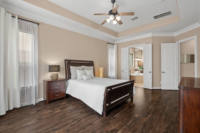 12011 Charlottes Bequest Cir, Cypress, TX 77433 - bedroom with a raised ceiling, dark wood finished floors, ensuite bathroom, baseboards, and crown molding