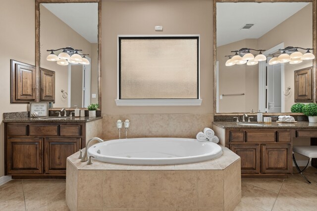 12011 Charlottes Bequest Cir, Cypress, TX 77433 - full bathroom with tile patterned flooring, a whirlpool tub, two vanities, and lofted ceiling