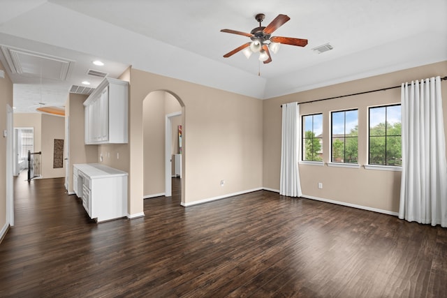 12011 Charlottes Bequest Cir, Cypress, TX 77433 - unfurnished living room featuring attic access, ceiling fan, dark wood finished floors, arched walkways, and baseboards