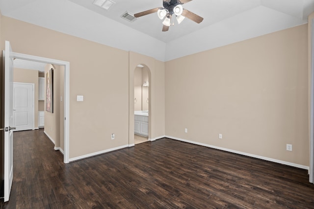 12011 Charlottes Bequest Cir, Cypress, TX 77433 - unfurnished bedroom featuring arched walkways, dark wood-style flooring, baseboards, connected bathroom, and a ceiling fan