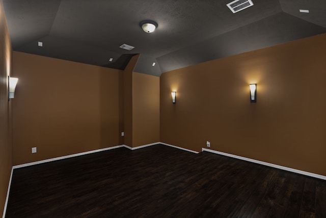 12011 Charlottes Bequest Cir, Cypress, TX 77433 - home theater featuring lofted ceiling, dark wood finished floors, and baseboards