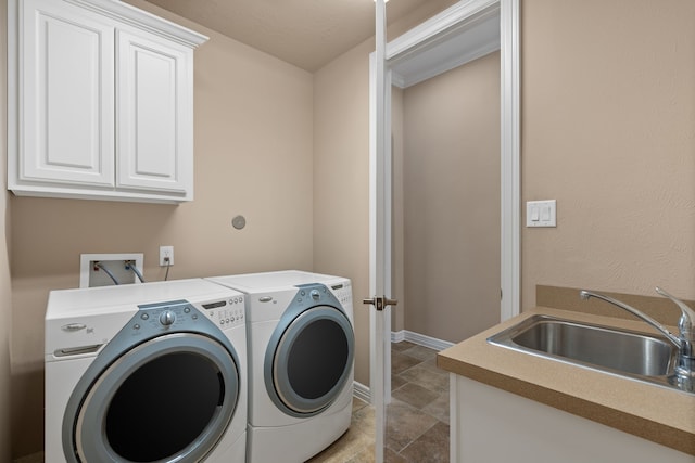 12011 Charlottes Bequest Cir, Cypress, TX 77433 - washroom with washer and dryer, cabinet space, stone tile floors, and baseboards