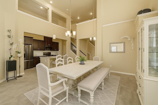 31550 Elkcreek Bend Dr, Hockley, TX 77447 - dining area with a high ceiling, a chandelier, baseboards, light tile patterned flooring, and recessed lighting