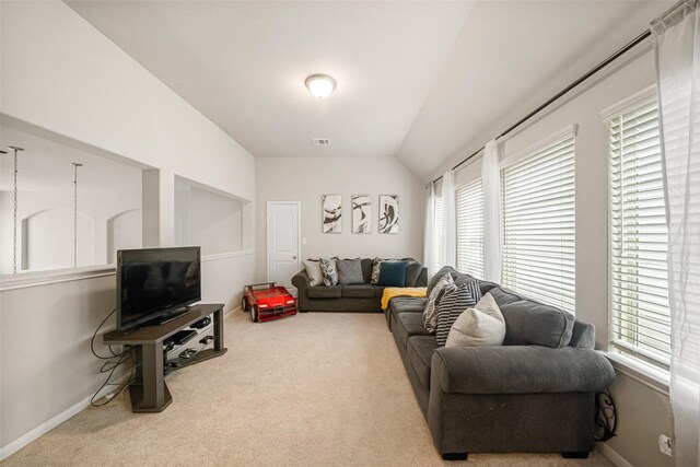 31550 Elkcreek Bend Dr, Hockley, TX 77447 - carpeted living room featuring baseboards and lofted ceiling