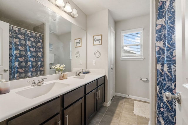31550 Elkcreek Bend Dr, Hockley, TX 77447 - full bathroom featuring double vanity, tile patterned flooring, baseboards, and a shower with curtain