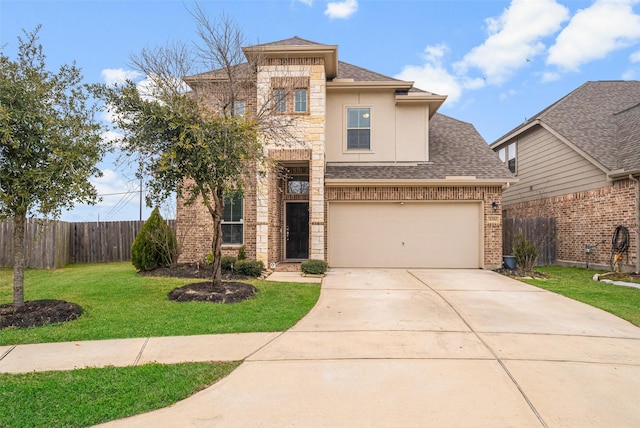 31550 Elkcreek Bend Dr, Hockley, TX 77447 - view of front of home with a shingled roof, driveway, stucco siding, brick siding, and an attached garage