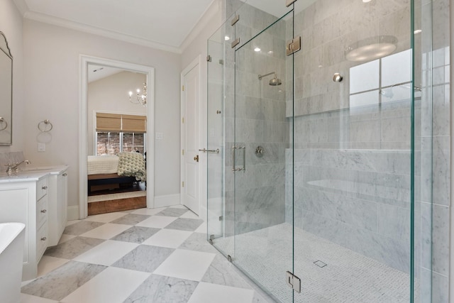 full bath with ensuite bathroom, a stall shower, crown molding, vanity, and a chandelier
