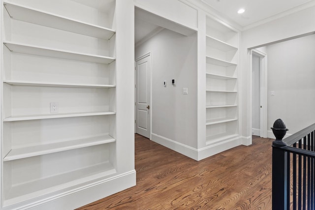 hall with wood finished floors, baseboards, and recessed lighting