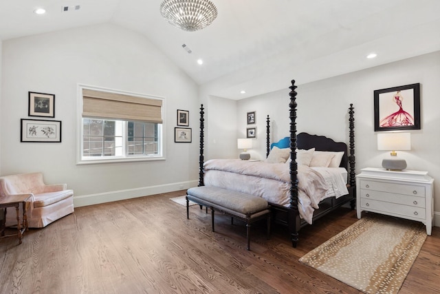 bedroom with lofted ceiling, wood finished floors, baseboards, and recessed lighting