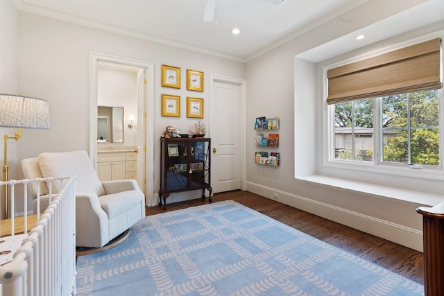 living area featuring ornamental molding, dark wood finished floors, recessed lighting, a ceiling fan, and baseboards