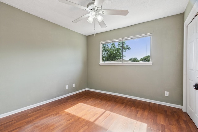 15623 Ensenada Dr, Houston, TX 77083 - spare room with wood finished floors, baseboards, and a ceiling fan