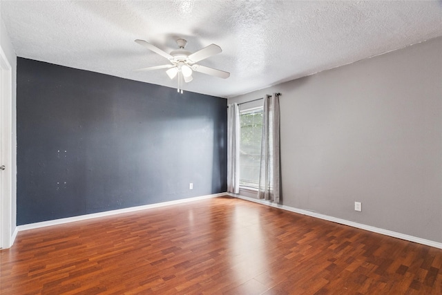 15623 Ensenada Dr, Houston, TX 77083 - unfurnished room with wood finished floors, ceiling fan, baseboards, and a textured ceiling