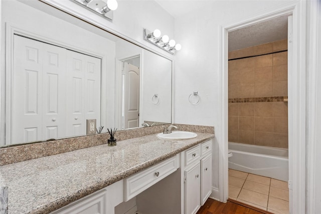15623 Ensenada Dr, Houston, TX 77083 - full bathroom with vanity, bathtub / shower combination, and wood finished floors