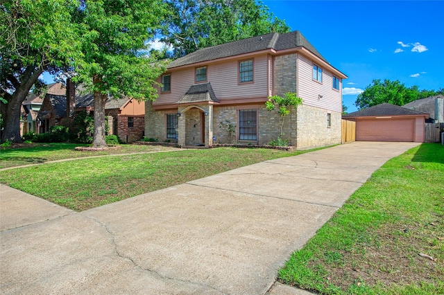 15623 Ensenada Dr, Houston, TX 77083 - view of front of house featuring brick siding, a front lawn, an outdoor structure, and a garage