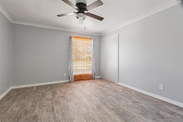 15623 Ensenada Dr, Houston, TX 77083 - spare room with wood finished floors, ornamental molding, ceiling fan, baseboards, and a textured ceiling
