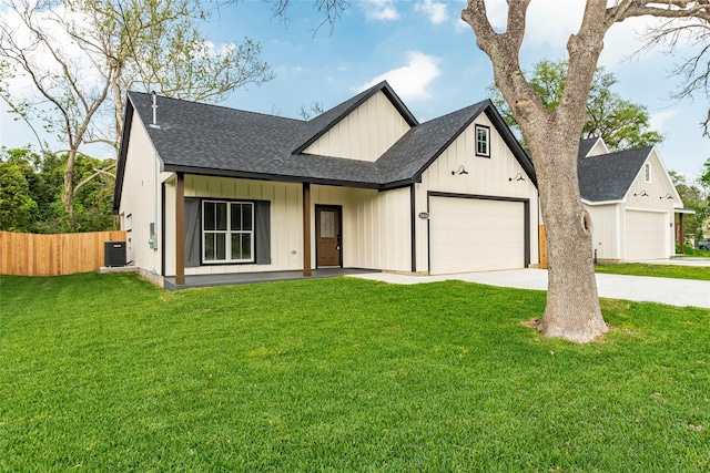 14606 W 6th St, Santa Fe, TX 77517 - modern farmhouse featuring roof with shingles, central AC, driveway, board and batten siding, and a garage