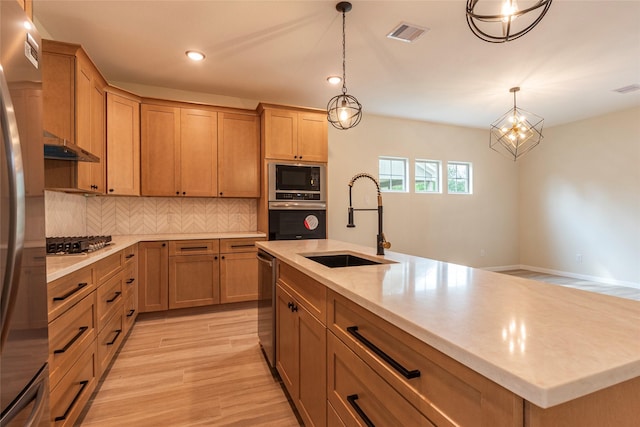 14606 W 6th St, Santa Fe, TX 77517 - kitchen with appliances with stainless steel finishes, a sink, backsplash, recessed lighting, and light wood-style floors