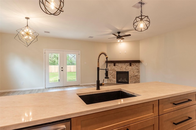 14606 W 6th St, Santa Fe, TX 77517 - kitchen featuring a sink, hanging light fixtures, french doors, and open floor plan