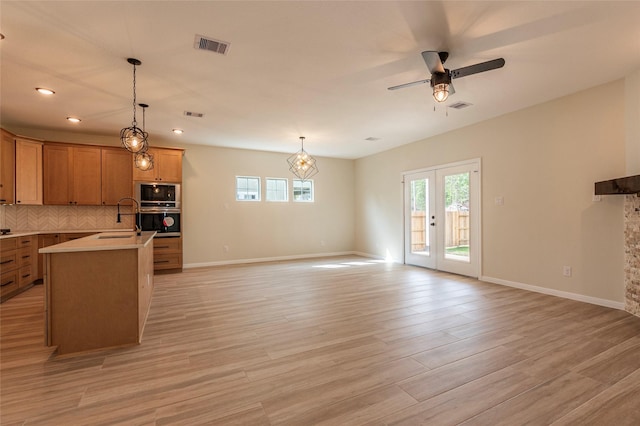14606 W 6th St, Santa Fe, TX 77517 - kitchen with oven, ceiling fan, built in microwave, plenty of natural light, and recessed lighting