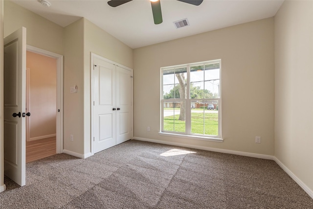 14606 W 6th St, Santa Fe, TX 77517 - unfurnished bedroom with carpet flooring, a closet, baseboards, and a ceiling fan