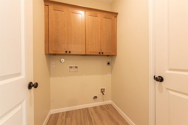 14606 W 6th St, Santa Fe, TX 77517 - washroom featuring hookup for an electric dryer, gas dryer hookup, hookup for a washing machine, cabinet space, and light wood finished floors