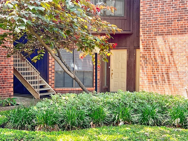 3130 Walnut Bend Ln Unit 409, Houston, TX 77042 - doorway to property featuring brick siding