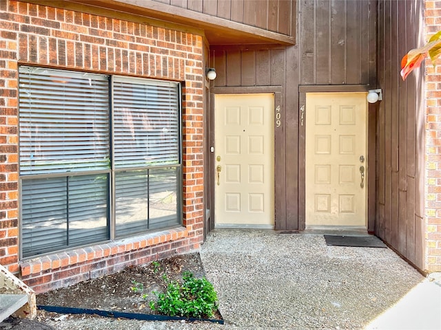 3130 Walnut Bend Ln Unit 409, Houston, TX 77042 - property entrance featuring brick siding and board and batten siding