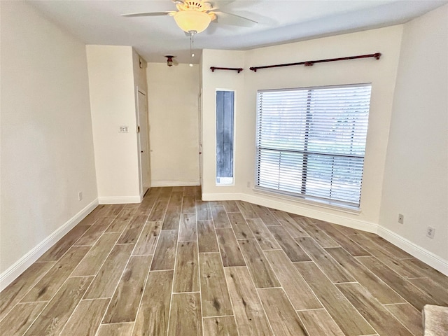 3130 Walnut Bend Ln Unit 409, Houston, TX 77042 - spare room with wood finished floors, ceiling fan, and baseboards