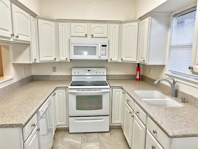 3130 Walnut Bend Ln Unit 409, Houston, TX 77042 - kitchen featuring white appliances, a sink, light countertops, and healthy amount of natural light