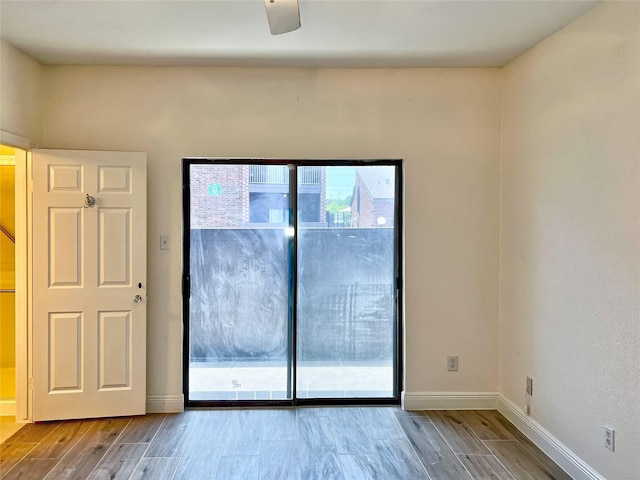 3130 Walnut Bend Ln Unit 409, Houston, TX 77042 - spare room with wood finished floors and baseboards