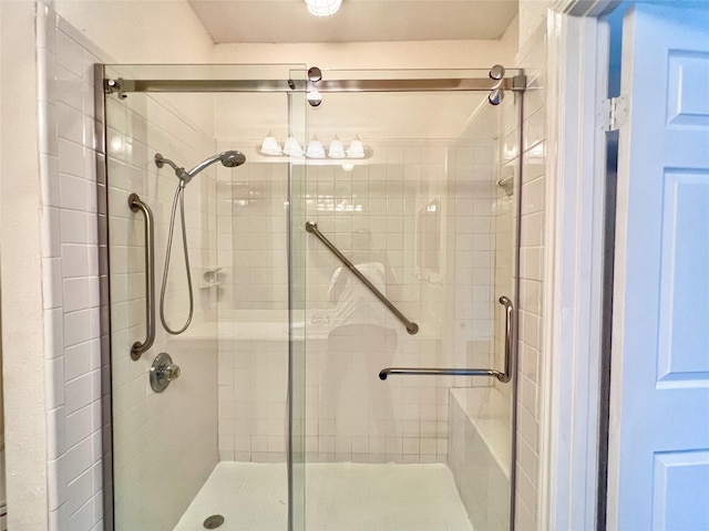 3130 Walnut Bend Ln Unit 409, Houston, TX 77042 - bathroom featuring a stall shower