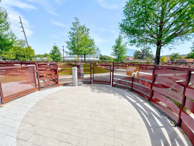 3130 Walnut Bend Ln Unit 409, Houston, TX 77042 - view of patio featuring a gate and fence