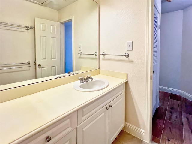 3130 Walnut Bend Ln Unit 409, Houston, TX 77042 - bathroom featuring vanity and baseboards