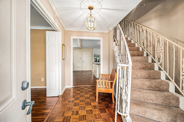 3823 Fernglade Dr, Houston, TX 77068 - foyer entrance featuring stairway, baseboards, a chandelier, crown molding, and a textured ceiling