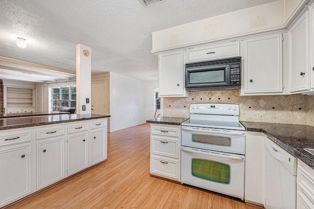 3823 Fernglade Dr, Houston, TX 77068 - kitchen featuring white appliances, a textured ceiling, light wood-style flooring, backsplash, and white cabinetry