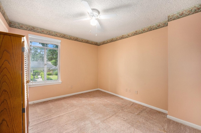 3823 Fernglade Dr, Houston, TX 77068 - spare room featuring a textured ceiling, carpet floors, a ceiling fan, and baseboards