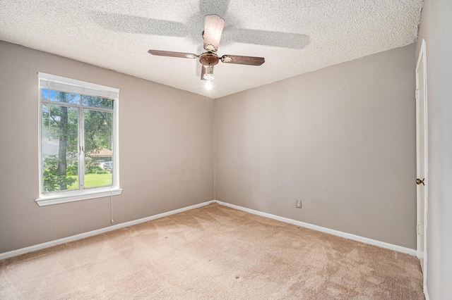 3823 Fernglade Dr, Houston, TX 77068 - unfurnished room with carpet, a ceiling fan, a textured ceiling, and baseboards