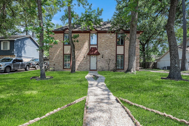 3823 Fernglade Dr, Houston, TX 77068 - view of front of home featuring a front yard and brick siding