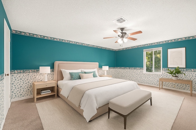 3823 Fernglade Dr, Houston, TX 77068 - bedroom with wallpapered walls, carpet floors, a textured ceiling, and a ceiling fan