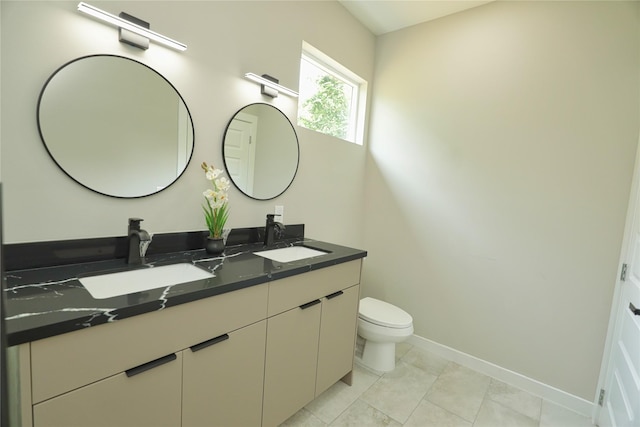 16803 Forest Trail Dr, Channelview, TX 77530 - full bath featuring toilet, double vanity, and baseboards
