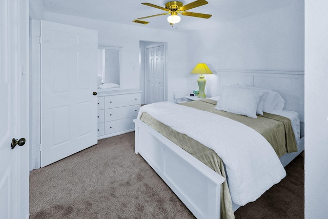 3100 75th St Unit 5, Galveston, TX 77551 - bedroom featuring carpet floors, a ceiling fan, and a closet