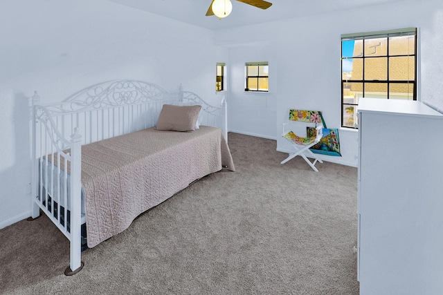 3100 75th St Unit 5, Galveston, TX 77551 - bedroom with carpet floors, ceiling fan, and baseboards