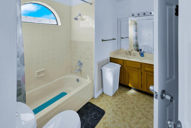 3100 75th St Unit 5, Galveston, TX 77551 - bathroom featuring toilet, shower / bath combo, and vanity