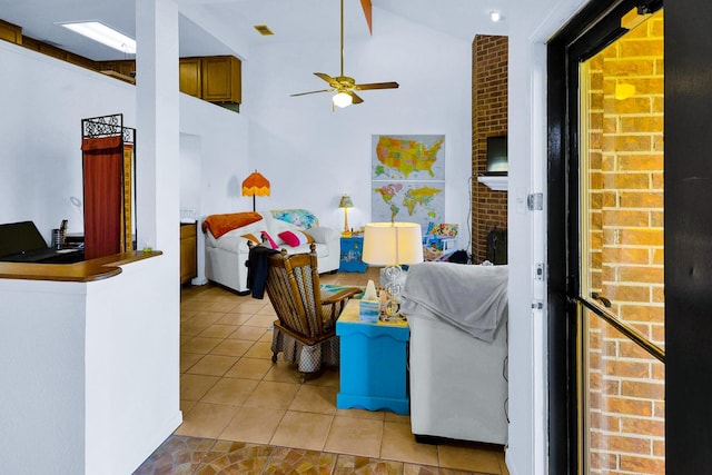 3100 75th St Unit 5, Galveston, TX 77551 - living room featuring light tile patterned flooring, ceiling fan, and high vaulted ceiling