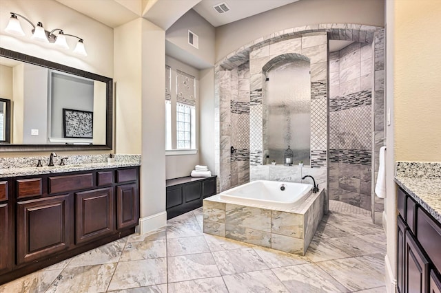 2919 Rutherford Place Ct, Katy, TX 77494 - bathroom with marble look tile flooring, walk in shower, vanity, a bath, and baseboards