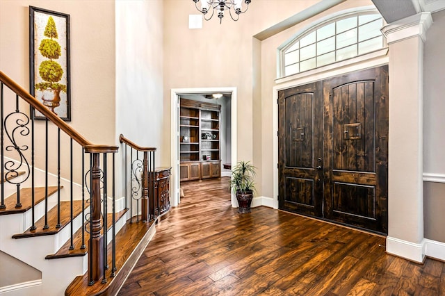 2919 Rutherford Place Ct, Katy, TX 77494 - foyer featuring hardwood / wood-style floors, baseboards, a high ceiling, and a chandelier