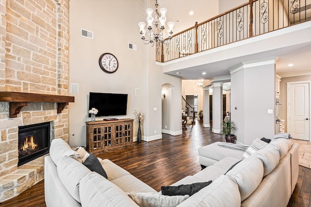 2919 Rutherford Place Ct, Katy, TX 77494 - living area with stairway, wood finished floors, a high ceiling, baseboards, and a stone fireplace