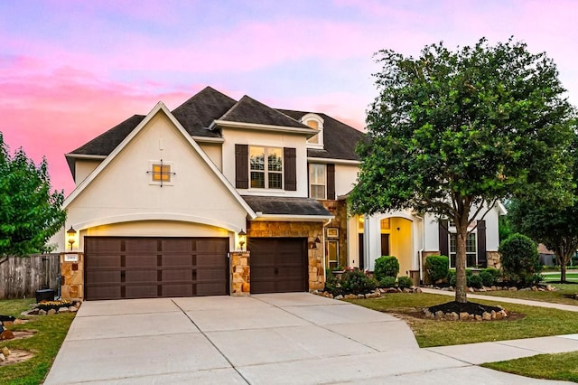 2919 Rutherford Place Ct, Katy, TX 77494 - french provincial home featuring stucco siding, stone siding, driveway, an attached garage, and roof with shingles