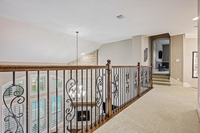 2919 Rutherford Place Ct, Katy, TX 77494 - hallway with vaulted ceiling, arched walkways, and carpet